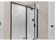 Modern shower features black hardware, glass door, and white tile at 872 Griffon Ave, Lake Alfred, FL 33850