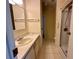 Bathroom featuring a tile floor, single sink vanity, and shower at 902 Rose Ln, Lady Lake, FL 32159