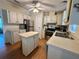 Functional kitchen features abundant cabinet space, updated appliances, and a convenient center island at 902 Rose Ln, Lady Lake, FL 32159