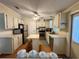Functional kitchen boasts ample cabinet space, modern appliances, and a convenient island at 902 Rose Ln, Lady Lake, FL 32159
