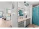 Bathroom featuring an ample vanity and shower/tub combination with a curtain at 10 Cocos Plumosa Dr, Eustis, FL 32726