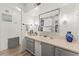 Bright bathroom featuring an ample vanity, mirror, and decorative lights at 10 Cocos Plumosa Dr, Eustis, FL 32726