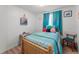 Cozy bedroom with cheerful decorations, bright curtains, and comfortable-looking bed at 10 Cocos Plumosa Dr, Eustis, FL 32726