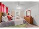 Bedroom with a king bed, dresser, and closet, well-lit by overhead lighting and natural light at 10 Cocos Plumosa Dr, Eustis, FL 32726
