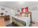 Bedroom with a king bed and decor overlooking the en-suite bathroom at 10 Cocos Plumosa Dr, Eustis, FL 32726