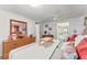 Bedroom with a king bed and decor overlooking the en-suite bathroom and walk-in closet at 10 Cocos Plumosa Dr, Eustis, FL 32726