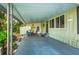 Spacious carport area with ample room for parking, along with a storage shed and outdoor seating at 10 Cocos Plumosa Dr, Eustis, FL 32726