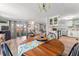 Bright dining and living area with laminate flooring, and lots of natural light at 10 Cocos Plumosa Dr, Eustis, FL 32726
