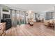 Open living area with laminate floors, comfy seating, and natural light at 10 Cocos Plumosa Dr, Eustis, FL 32726