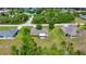 Residential home with mature trees and screened in patio in a tranquil suburban setting at 10331 Sw 45Th Ave, Ocala, FL 34476