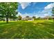 Over-sized backyard with green grass and a sunroom, providing ample outdoor space at 10331 Sw 45Th Ave, Ocala, FL 34476