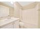 Bathroom featuring a single sink vanity with a shower and tub combo at 10331 Sw 45Th Ave, Ocala, FL 34476