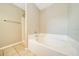 Bathroom featuring large soaking tub and tile flooring at 10331 Sw 45Th Ave, Ocala, FL 34476