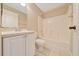 Bathroom featuring a single sink vanity with a shower and tub combo at 10331 Sw 45Th Ave, Ocala, FL 34476