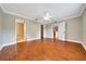 Spacious bedroom with wood floors, walk-in closet, and adjoining bathroom at 10331 Sw 45Th Ave, Ocala, FL 34476