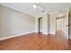 Bedroom with wood floors, overhead lighting, and closet at 10331 Sw 45Th Ave, Ocala, FL 34476