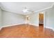 Bedroom with wood floors, overhead light, and closet at 10331 Sw 45Th Ave, Ocala, FL 34476