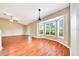 Dining area with bay window, hardwood floors, and access to the backyard at 10331 Sw 45Th Ave, Ocala, FL 34476