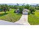 Well-kept home has a lush green lawn, mature landscaping, and extended driveway at 10331 Sw 45Th Ave, Ocala, FL 34476
