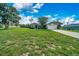 Charming single-story home with a well-manicured lawn and mature tree in the front yard at 10331 Sw 45Th Ave, Ocala, FL 34476