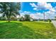 Charming single-story home with a well-manicured lawn and mature tree in the front yard at 10331 Sw 45Th Ave, Ocala, FL 34476
