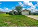Charming single-story home with a well-manicured lawn and mature tree in the front yard at 10331 Sw 45Th Ave, Ocala, FL 34476