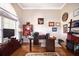 Bright office with hardwood floors, a desk, and plenty of display space at 1043 Juliette Blvd, Mount Dora, FL 32757