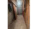 Spacious unfinished basement area with concrete block walls and a garage door entrance, offering potential for storage at 11532 Beaman Cir, Clermont, FL 34711
