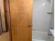 Bathroom with white tile and tub at 11532 Beaman Cir, Clermont, FL 34711