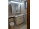 A bathroom with a white sink and vanity at 11532 Beaman Cir, Clermont, FL 34711