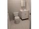 Bathroom featuring a toilet and vanity with a white cabinet at 11532 Beaman Cir, Clermont, FL 34711