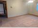 Spacious bedroom featuring neutral carpet and natural light from a large window at 11532 Beaman Cir, Clermont, FL 34711