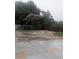 Covered carport with basketball hoop and concrete base at 11532 Beaman Cir, Clermont, FL 34711