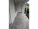 Covered front porch with white brick detail at 11532 Beaman Cir, Clermont, FL 34711