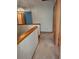 Hallway features wooden trim and neutral carpet flooring at 11532 Beaman Cir, Clermont, FL 34711