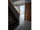 Hallway view with staircase, closet and tile flooring at 11532 Beaman Cir, Clermont, FL 34711