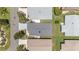 Aerial view of the home, showcasing the roof, landscaping, and surrounding neighborhood at 1334 Hollyberry Pl, The Villages, FL 32162