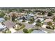 A beautiful aerial view of a quiet residential neighborhood featuring well-maintained homes and lush landscaping at 1334 Hollyberry Pl, The Villages, FL 32162