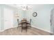 Cozy breakfast nook with a round dining table and seating for four at 1334 Hollyberry Pl, The Villages, FL 32162