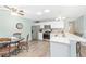 Well-appointed kitchen featuring stainless steel appliances, a breakfast nook, and ample cabinet space at 1334 Hollyberry Pl, The Villages, FL 32162