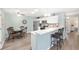Well-equipped kitchen with modern stainless steel appliances and a bright breakfast nook at 1334 Hollyberry Pl, The Villages, FL 32162