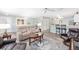 Comfortable living room with ceiling fan and luxury vinyl flooring, blending relaxation and style at 1334 Hollyberry Pl, The Villages, FL 32162
