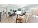 Relaxing living room featuring recliner seating, modern décor, and a ceiling fan for added comfort at 1334 Hollyberry Pl, The Villages, FL 32162