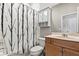Bathroom featuring a vanity with storage, toilet, and shower with stylish shower curtain at 1444 Whitney Isles Dr, Windermere, FL 34786