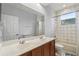 Bathroom featuring double sinks, neutral tile, and shower-tub combo with natural light at 1444 Whitney Isles Dr, Windermere, FL 34786