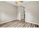 Neutral bedroom with hardwood floors, ceiling fan, and double door closet at 1444 Whitney Isles Dr, Windermere, FL 34786