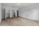 Bedroom featuring neutral paint and carpet with multiple doors and a walk-in closet at 1444 Whitney Isles Dr, Windermere, FL 34786