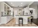 Bright kitchen with granite countertops, stainless appliances, and counter seating at 1444 Whitney Isles Dr, Windermere, FL 34786