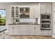 Kitchen featuring granite countertops, stainless steel appliances, and white cabinetry at 1444 Whitney Isles Dr, Windermere, FL 34786