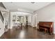 Spacious living room with hardwood floors, arched doorways, and neutral paint at 1444 Whitney Isles Dr, Windermere, FL 34786